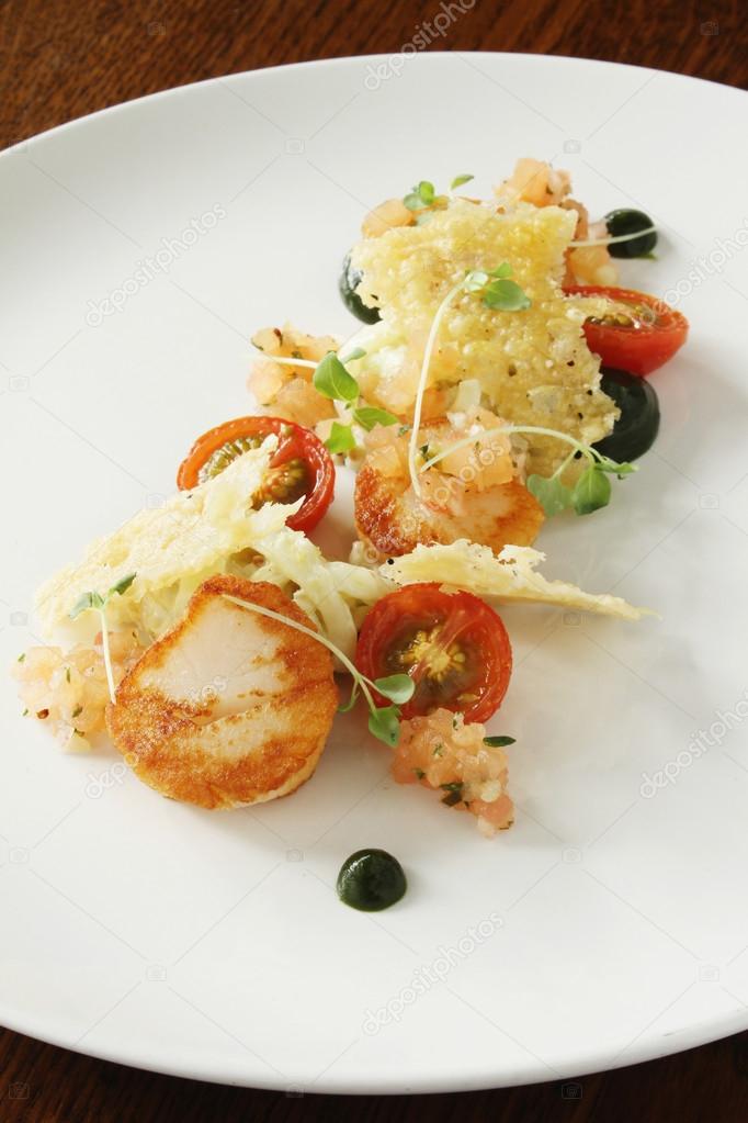Pan fried scallop shelfish appetizer Stock Photo by ©neillangan 121303952