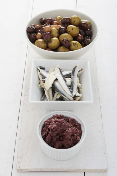 Pickled anchovies in dish — Stock Photo, Image