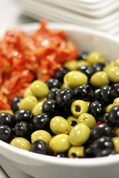 Fresh olives in white bowl — Stock Photo, Image