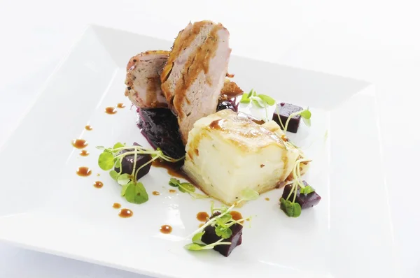 Plated pork dinner meal — Stock Photo, Image