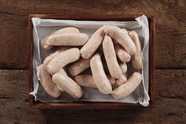 Uncooked linked British sausages — Stock Photo, Image