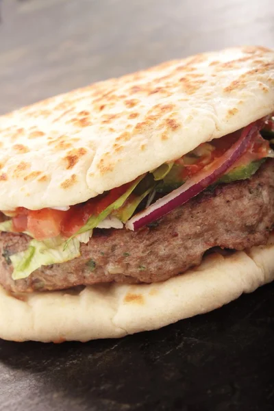 Burger in bun closeup — Stock Photo, Image