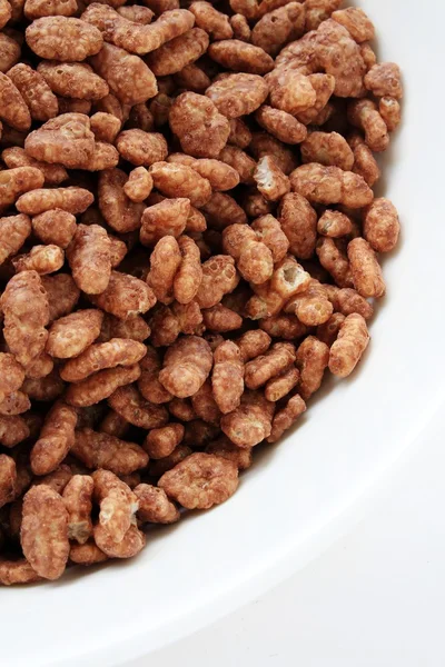 Chocolate cornflakes in white bowl — Stock Photo, Image