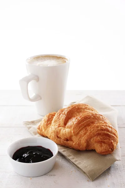 Fresh baked croissant with coffee Stock Picture