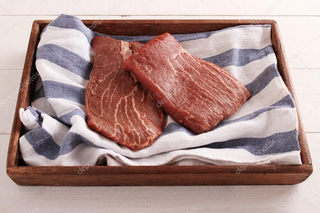 raw uncooked steaks
