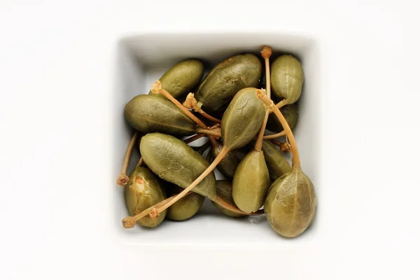 Caper berries in bowl — Stock Photo, Image