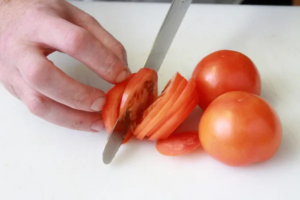 Koka skära tomater — Stockfoto