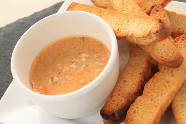 Roast pepper dip with toasted bread fingers — Stock Photo, Image