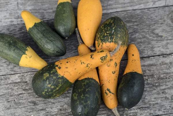 Pumpkins on wood texture — Stock Photo, Image