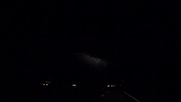 SLOW MOTION: Thunderstorm lightning bolt striking over traffic road — Stok video