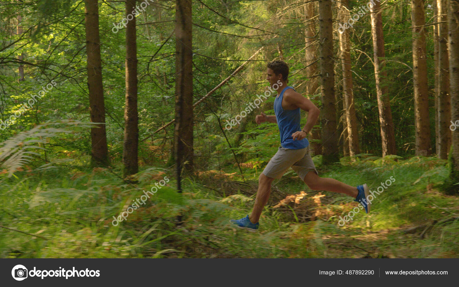 Sporty guy working out and jogging in the beautiful and calm