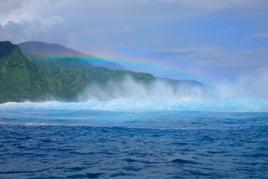 DRONE: Flying towards the beautiful breaking teahupoo wave in sunny Tahiti.