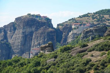 DRONE: Small rural village sits on top of a cliff in the rugged Greek mountains.
