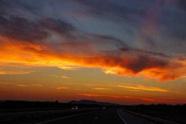 Colorful cloudy evening sky illuminates the newly constructed highway in Croatia