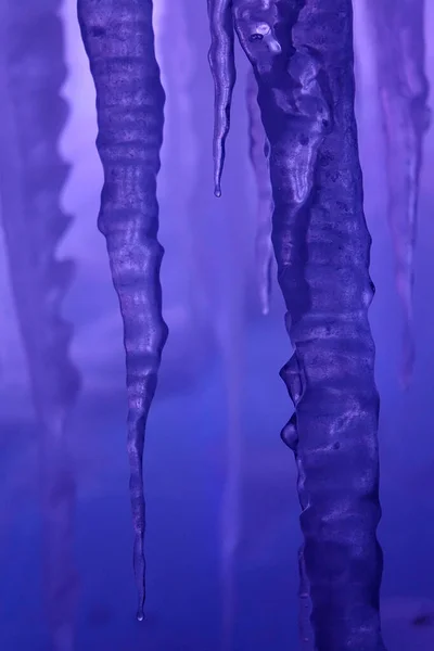 VERTICAL: Detailed shot of a long icicle inside an ice grotto in Colorado. — Stock Photo, Image