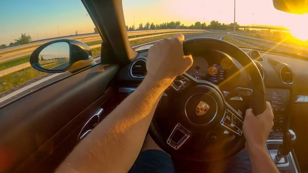 POV: First person shot of cruising down the freeway in a Porsche at sunset. — ストック写真