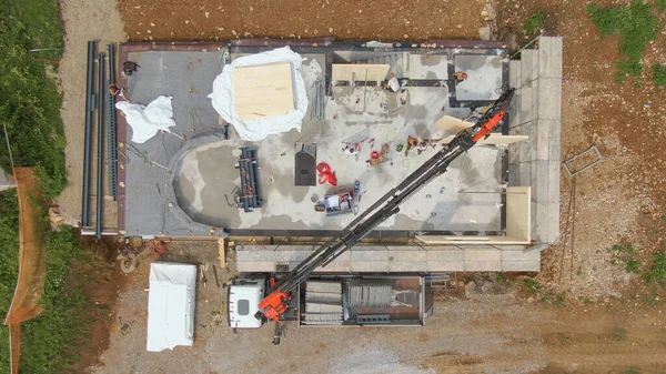 TOP DOWN: Drone point of view of CLT house being built in idyllic countryside. — ストック写真