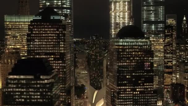 AERIAL: Flying among spectacular towering skyscrapers of New York City at night. — Stock Video