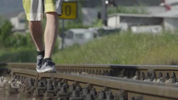 Walking on railroad tracks — Stock Video