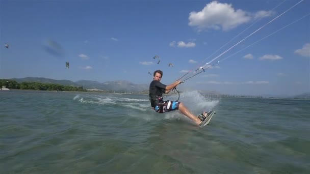 Kiteboarder jumps — Stock Video