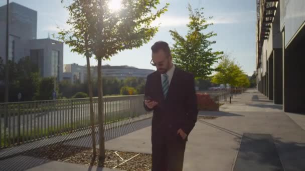 Businessman checking his smartphone — Stock Video