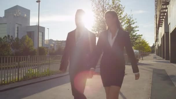 Businessman and businesswoman walking — Stock Video