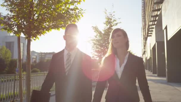 Businessman and businesswoman walking — Stock Video