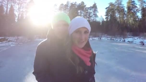 Couple spinning on ice skates — Stock Video