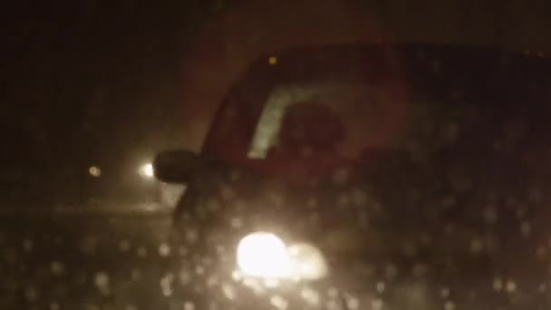 Heavy traffic in blizzard on a winter night — Stock Video