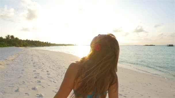 Woman enjoying vacations on sunset beach — Stock Video