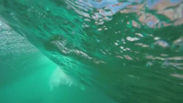 UNDERWATER SLOW MOTION: Beautiful big tube wave breaking over camera — Stock Video