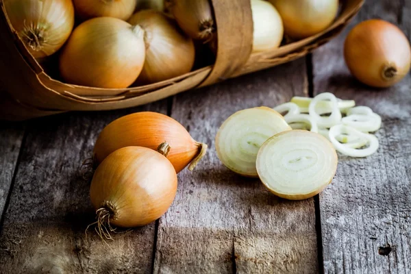 Fresh organic onions in a basket