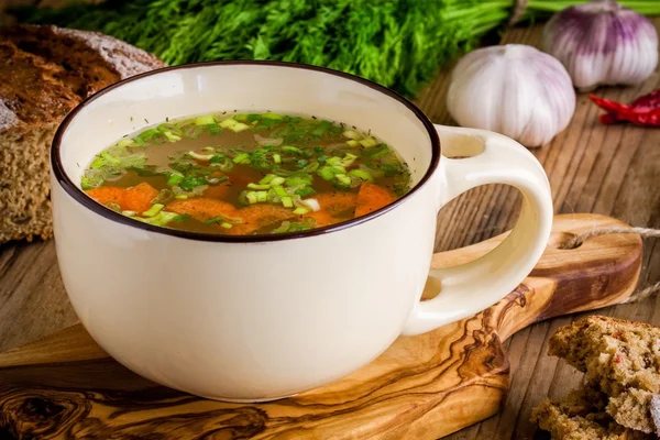 Cup with vegetable soup with bread — Stock Photo, Image