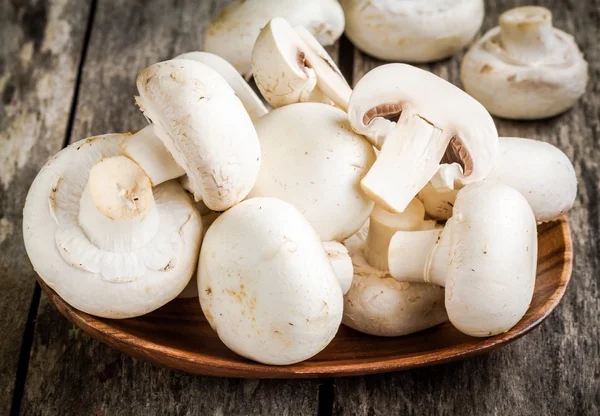 Raw fresh champignons in  the bowl close up — Stock Photo, Image