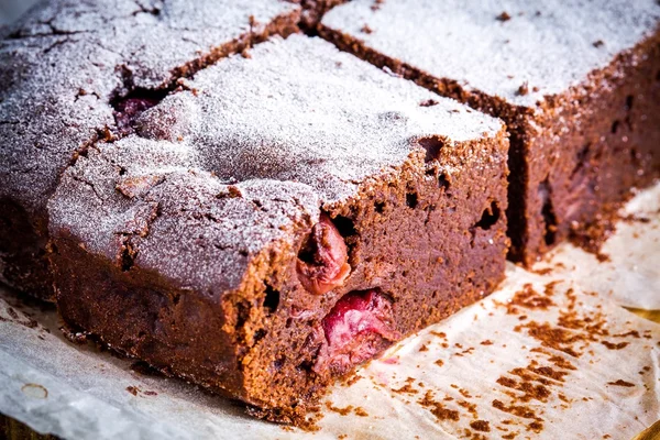 Chocolate brownie dessert with cherries closeup — Stockfoto