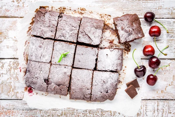 Homemade chocolate brownie dessert with a cherry — ストック写真