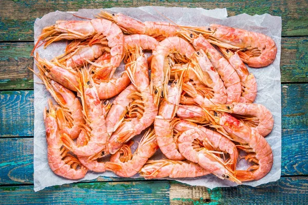 Fresh raw prawns on paper — Stok fotoğraf