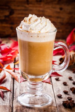 pumpkin latte with whipped cream in a glass jar clipart