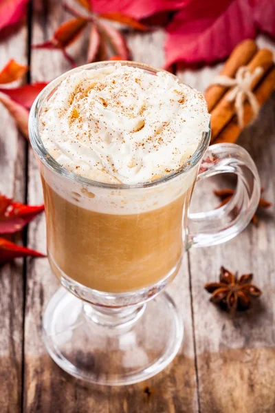 Pumpkin latte with whipped cream in a glass jar — Stock Photo, Image