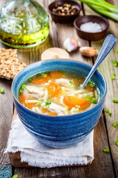 Chicken noodle soup with carrots and green onions — Stock Photo, Image