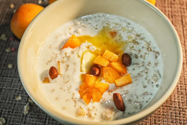 Oatmeal Apricot Nuts Close Plate Delicious Healthy Breakfast — Stock Photo, Image