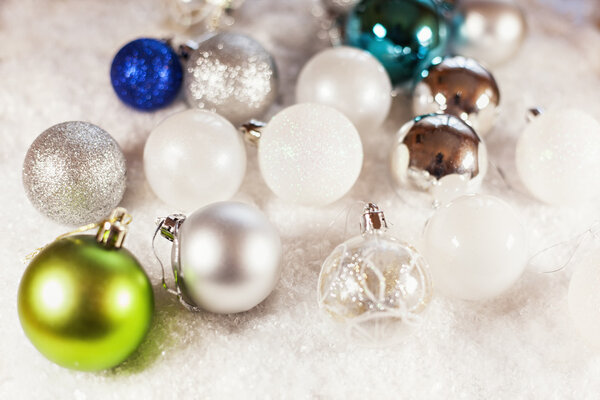 A Lot Of Baubles On Snowy Background