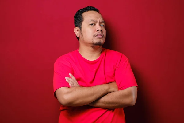 Portrait Young Asian Man Staring Camera Suspicious Cynical Expression Arms — Stock Photo, Image