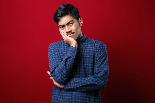 Young Asian Man Wearing Casual Shirt Red Background Thinking Looking — Stock Photo, Image