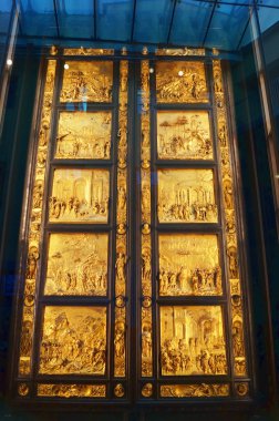The original door of paradise in the Opera del Duomo museum Florence Italy clipart