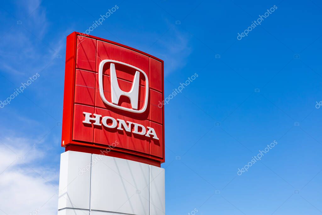 Ottawa, Ontario, Canada - May 31, 2021: The logo for Honda Motor Company (TYO: 7267, NYSE: HMC) on a sign at a car dealership.