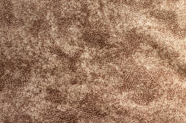 Koyu kahverengi, yoğun bir kumaşın farklı bir deseni var..