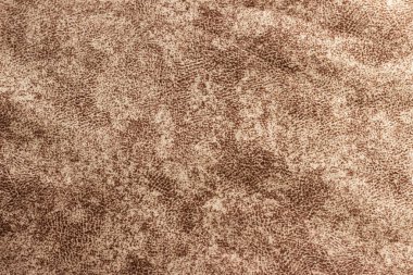 Koyu kahverengi, yoğun bir kumaşın farklı bir deseni var..