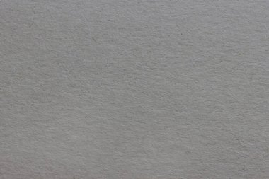 Lekeli ve lifli pürüzlü gri kağıdın dokusu.