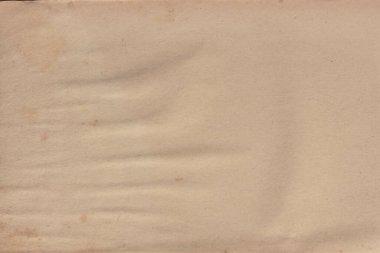 Kitabın kapağında lekeler olan eski sarı kağıt..